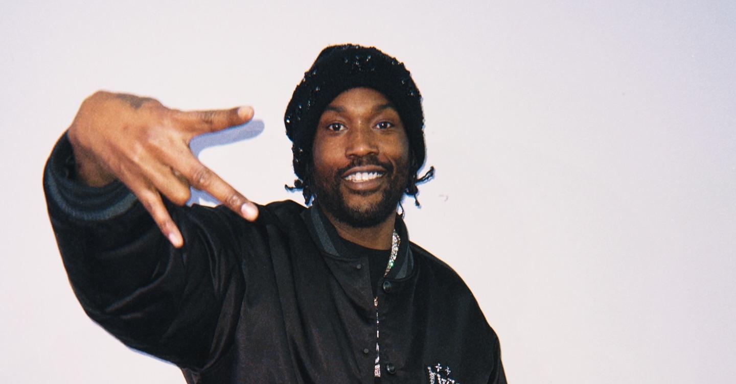 Meek Mill wears a black jacket