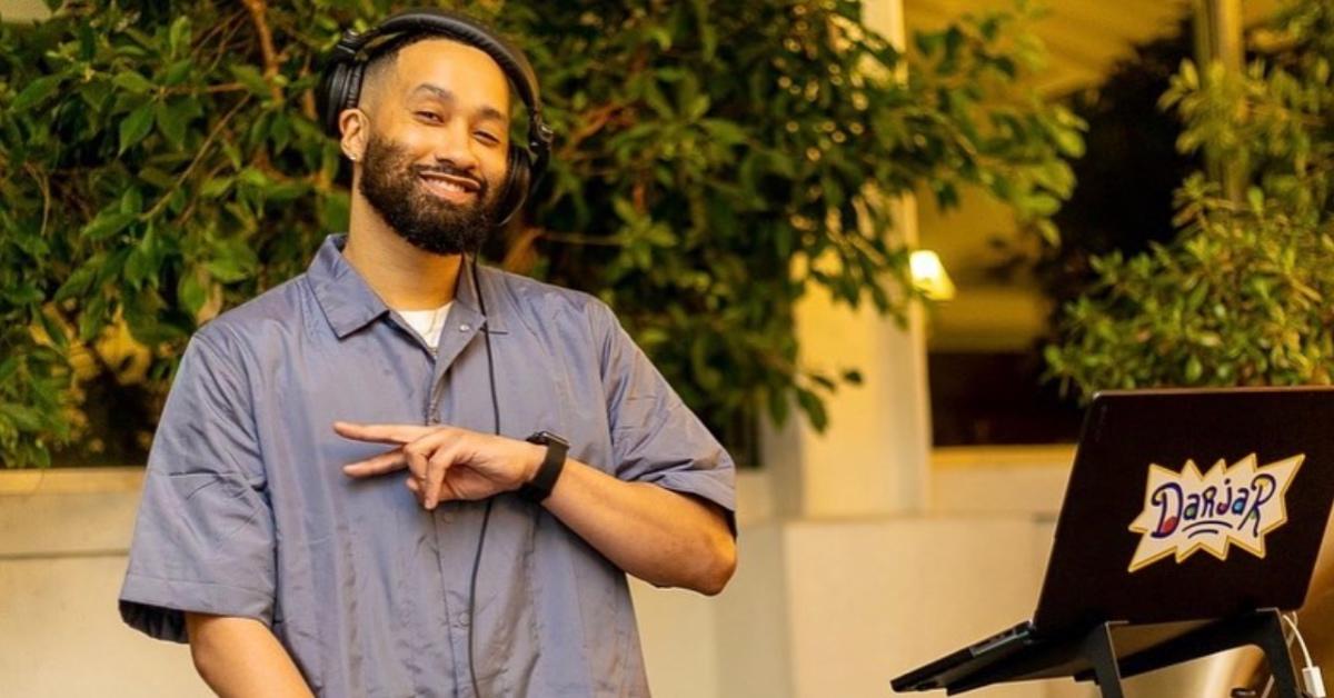 DJ Dar Jar in a blue shirt working an event.