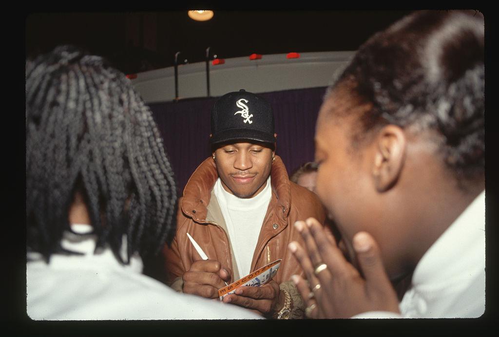 Rapper LL Cool J signs autographs for his fans. 