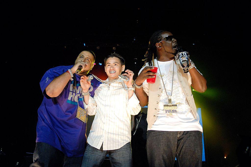 Johnny Dang flaunts jewelry on stage with DJ Khaled and T-Pain.