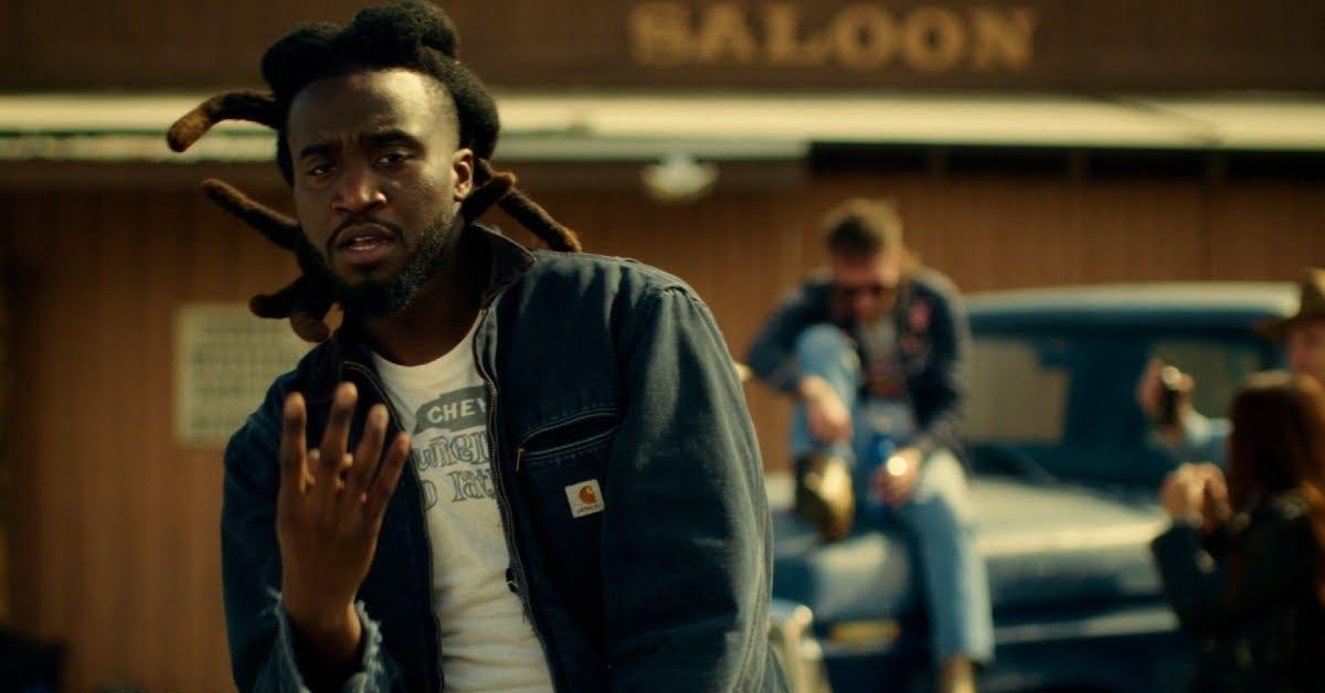 Shaboozey sings in the music video for "Bar (Tipsy)".