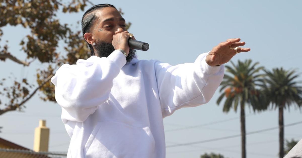 Nipsey Hussle speaks to kids at the Nipsey Hussle x PUMA Hoops Basketball Court Refurbishment Reveal Event on October 22, 2018 in Los Angeles, California.