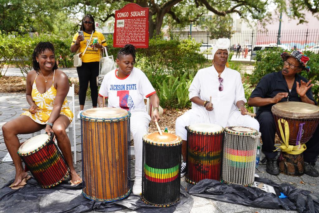 A drum circle takes place in Congo Square during ESSENCE Family Day