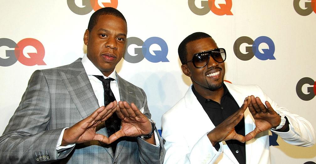 jay z and kanye holding up roc sign