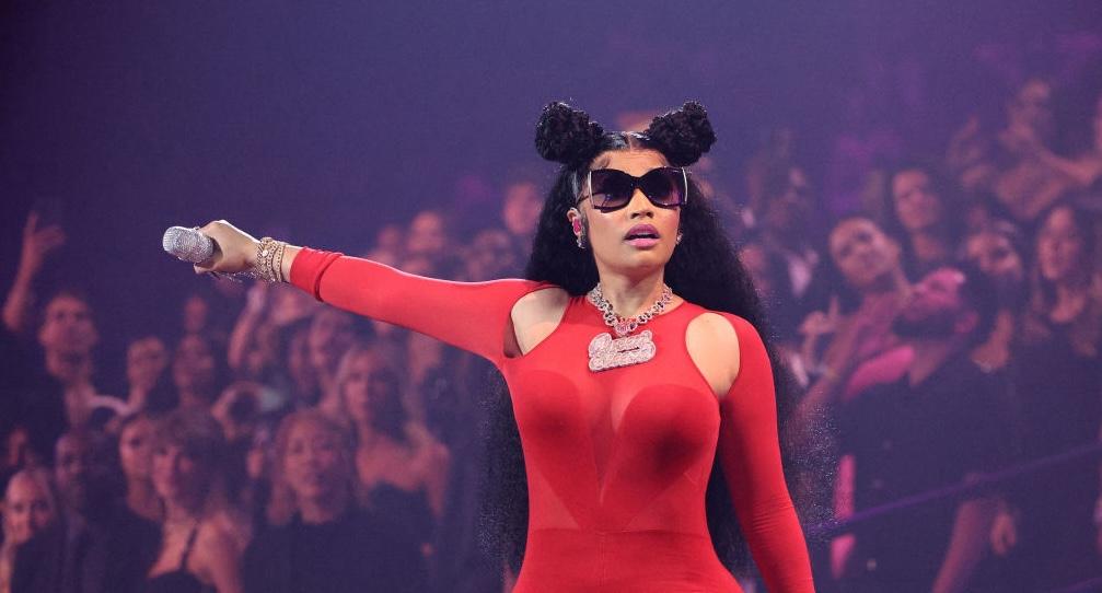 Nicki Minaj performs onstage during the MTV Video Music Awards at Prudential Center wearing an all red outfit