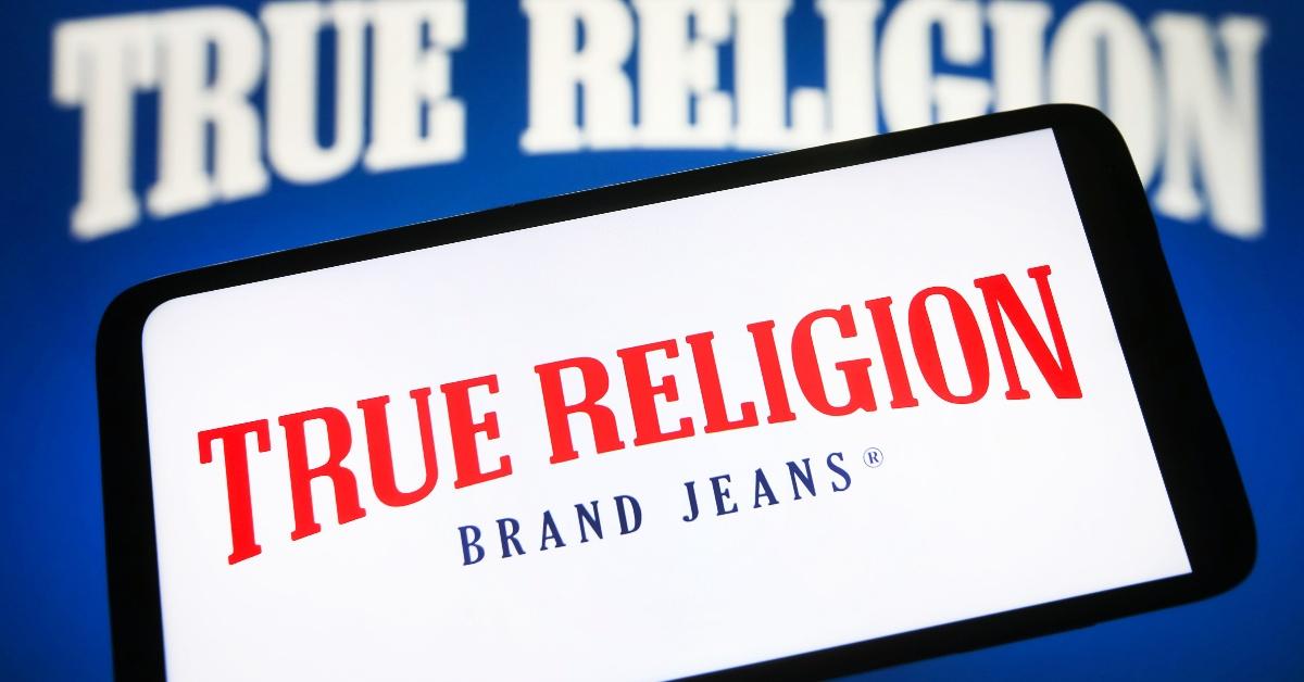 true religion brand jeans logo is seen on a smartphone screen