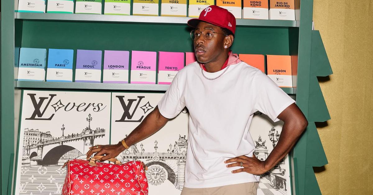 tyler with lv bag at lv stand