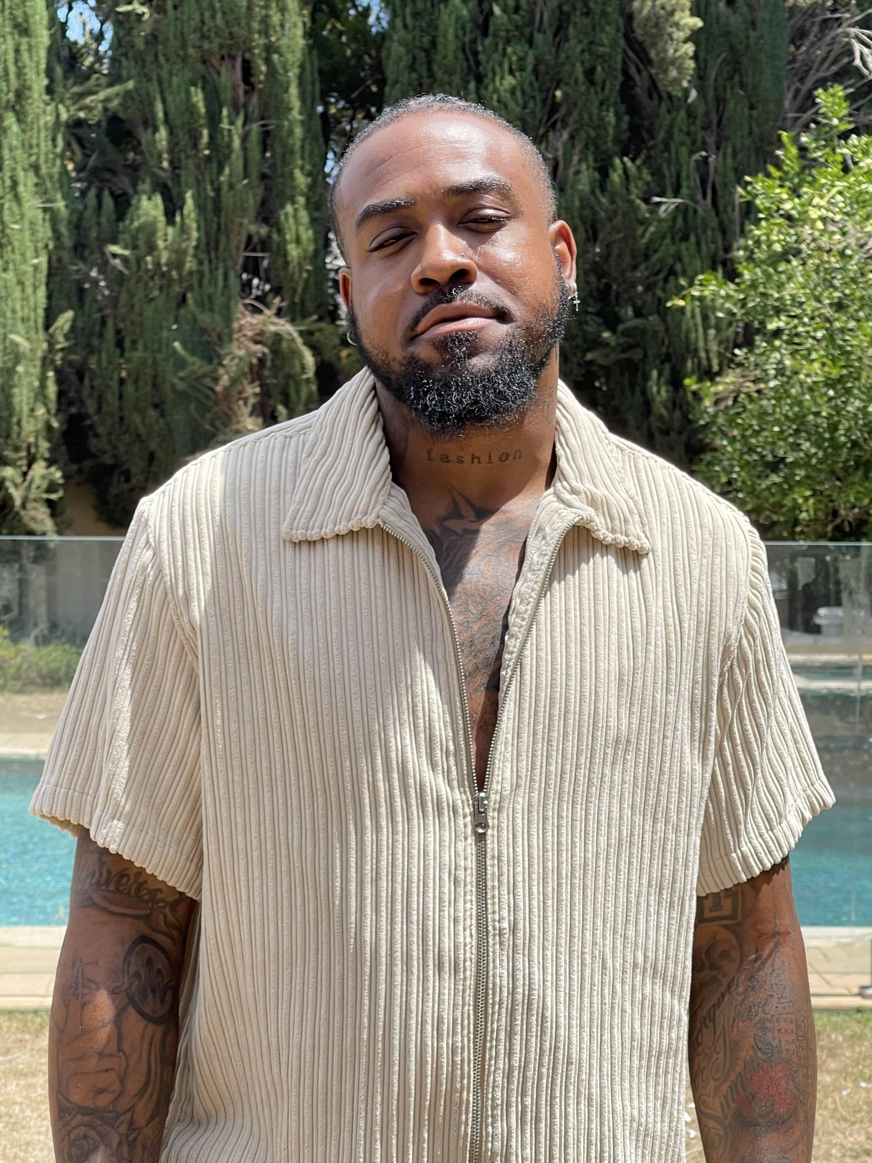 Hakeem Harris poses by a pool. 