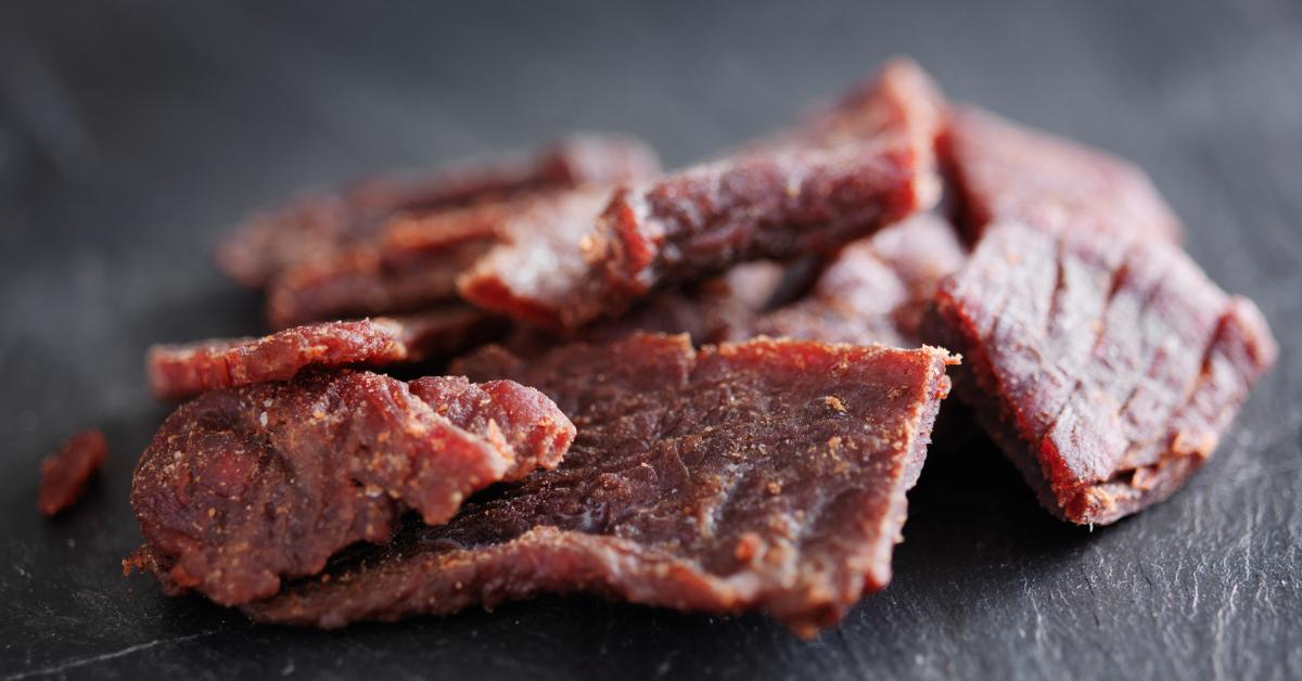 beef jerky in a pile on slate surface