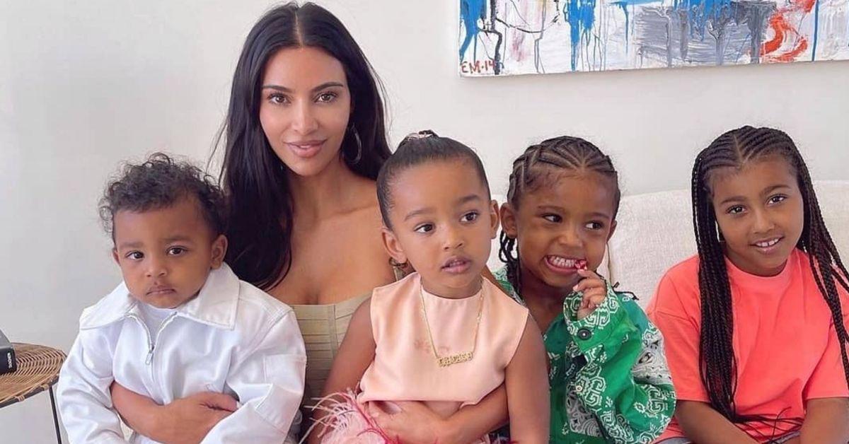 Kim Kardashian poses for a photo with her kids Psalm, Chicago seated on her lap, with Saint, and North seated next to her for a family photo