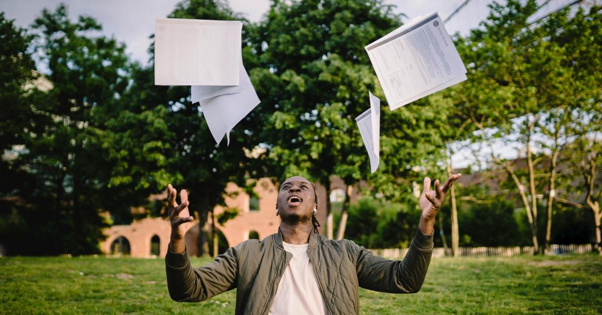 black man throws up paperwork