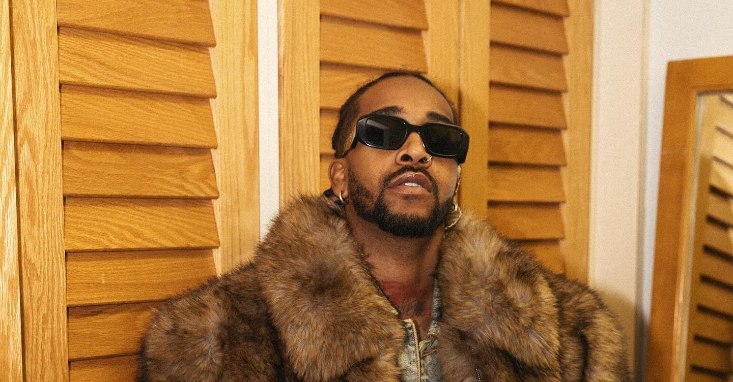 Omarion in a fur coat and sunglasses