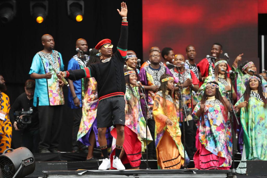 Wizkid performs with the Soweto Gospel Choir during the Global Citizen Festival in South Africa