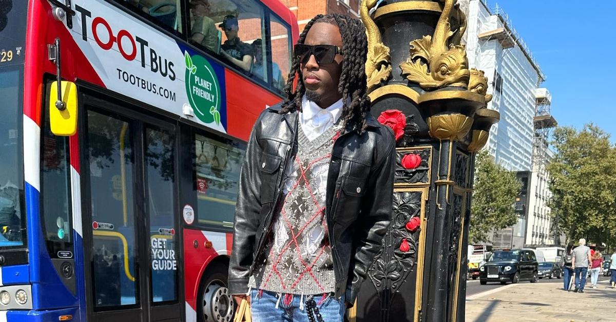 kai cenat poses on a street in london