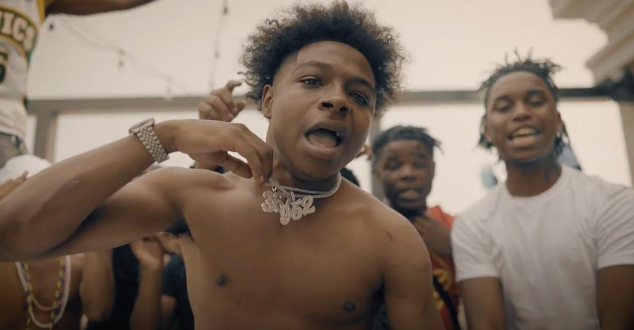 Anti Da Menace raps in his video "Big Eyez" without a shirt on wearing a diamond chain.