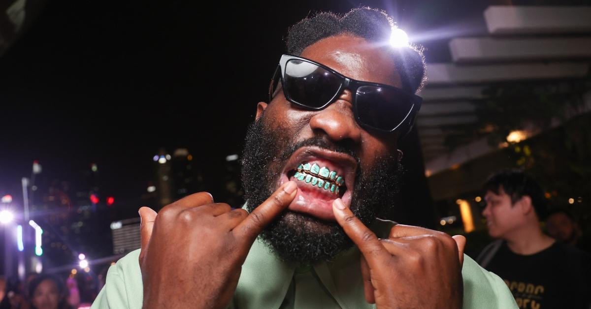  Tobe Nwigwe shows his grill attends the World Premiere of Paramount Pictures' "Transformers: Rise of the Beasts" at Marina Bay Sands on May 27, 2023 in Singapore, Singapore