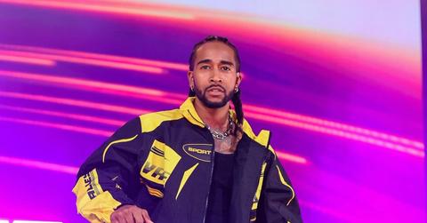 Omarion performs on stage.