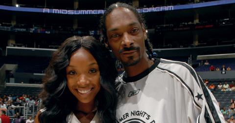 Brandy and Snoop Dogg pose before A Midsummer Night's Dream Celebrity and All-Star Basketball Game on July 9, 2006 .