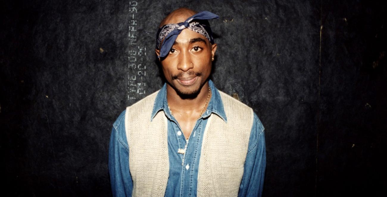 rapper tupac shakur poses for photos backstage after his performance at the regal theater