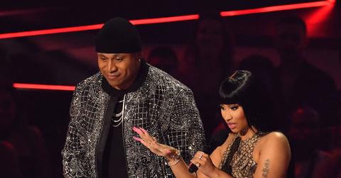 LL Cool J and Nicki Minaj speak onstage during the MTV Video Music Awards