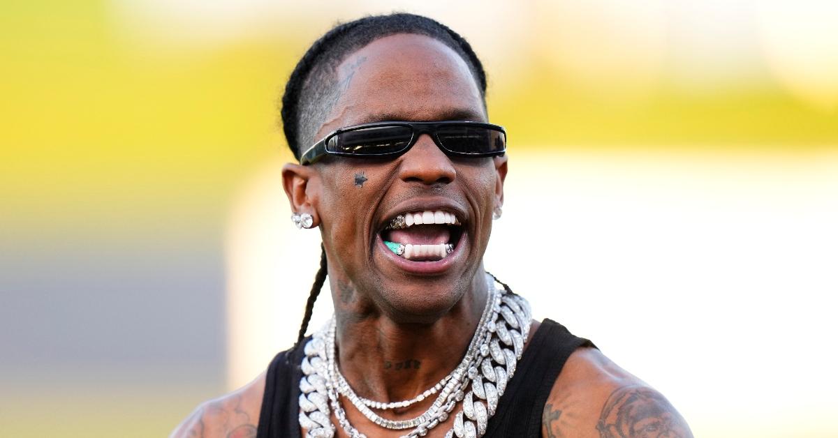 travis scott celebrates after throwing the opening pitch prior to a game between the washington nati