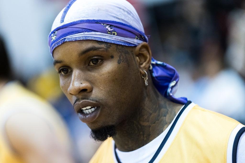 tory lanez wears a durag and yellow shirt