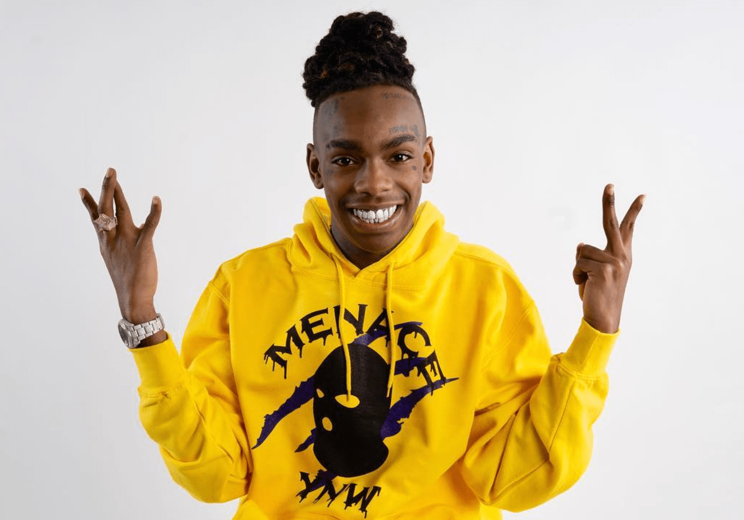 Still shot of YNW Melly wearing yellow hoodie