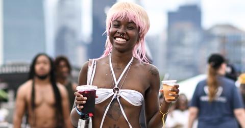 A girl smiling at a festival.