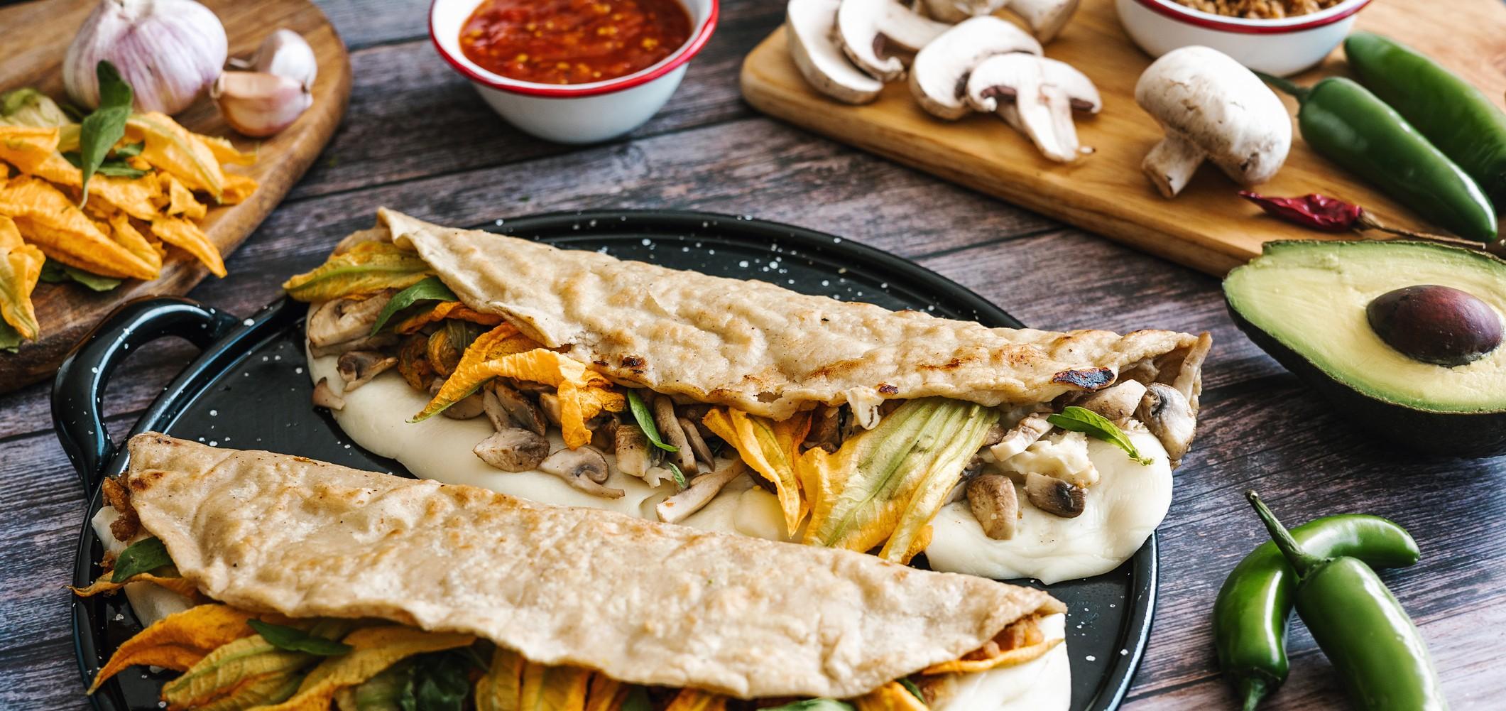 mexican chicharron quesadilla with oaxaca cheese and squash blossom