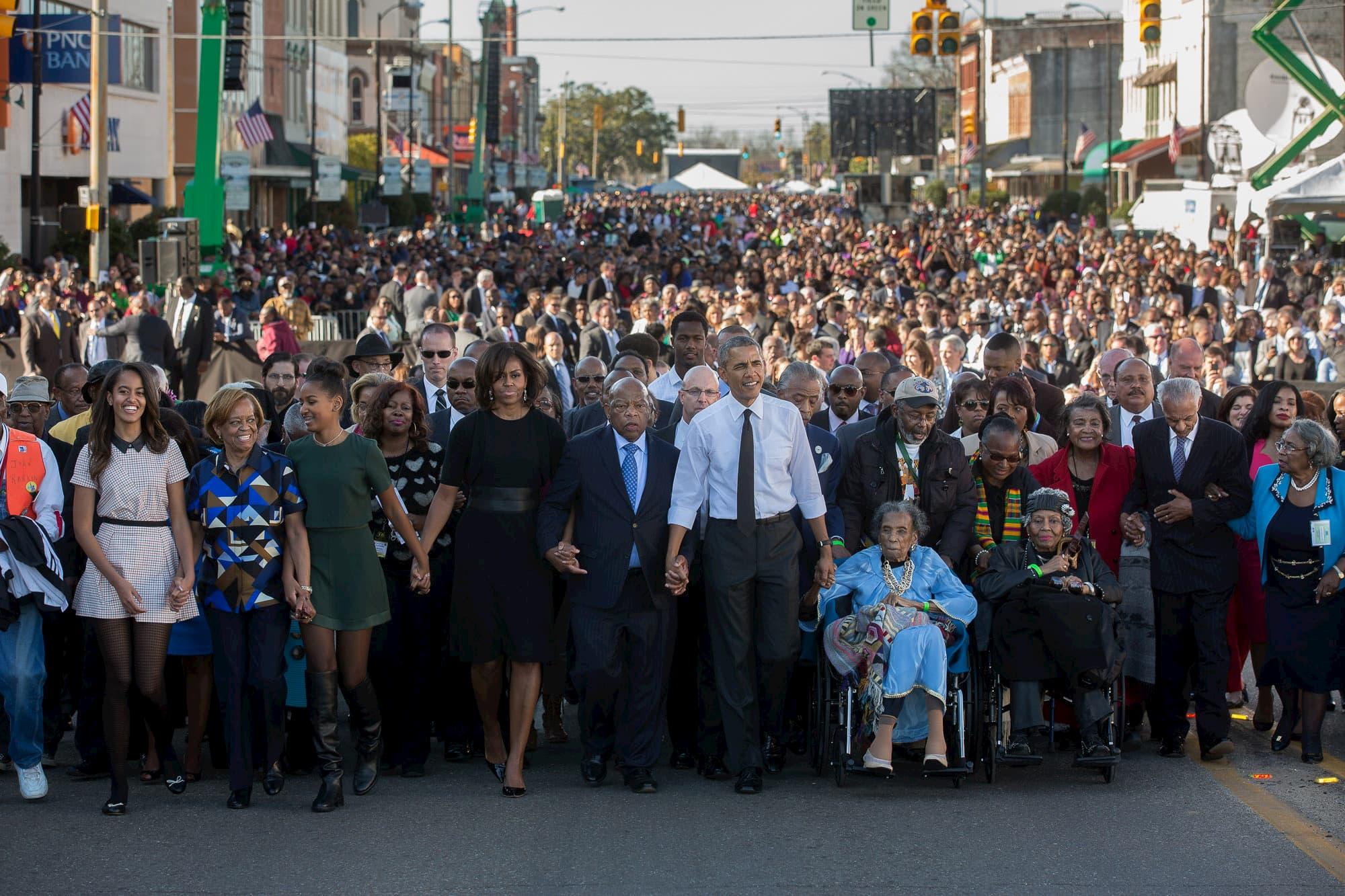 wp content/uploads///Obamas crossing Edmund Pettus Bridge in Selma on th Anniversary of Bloody Sunday  x Lawrence Jackson