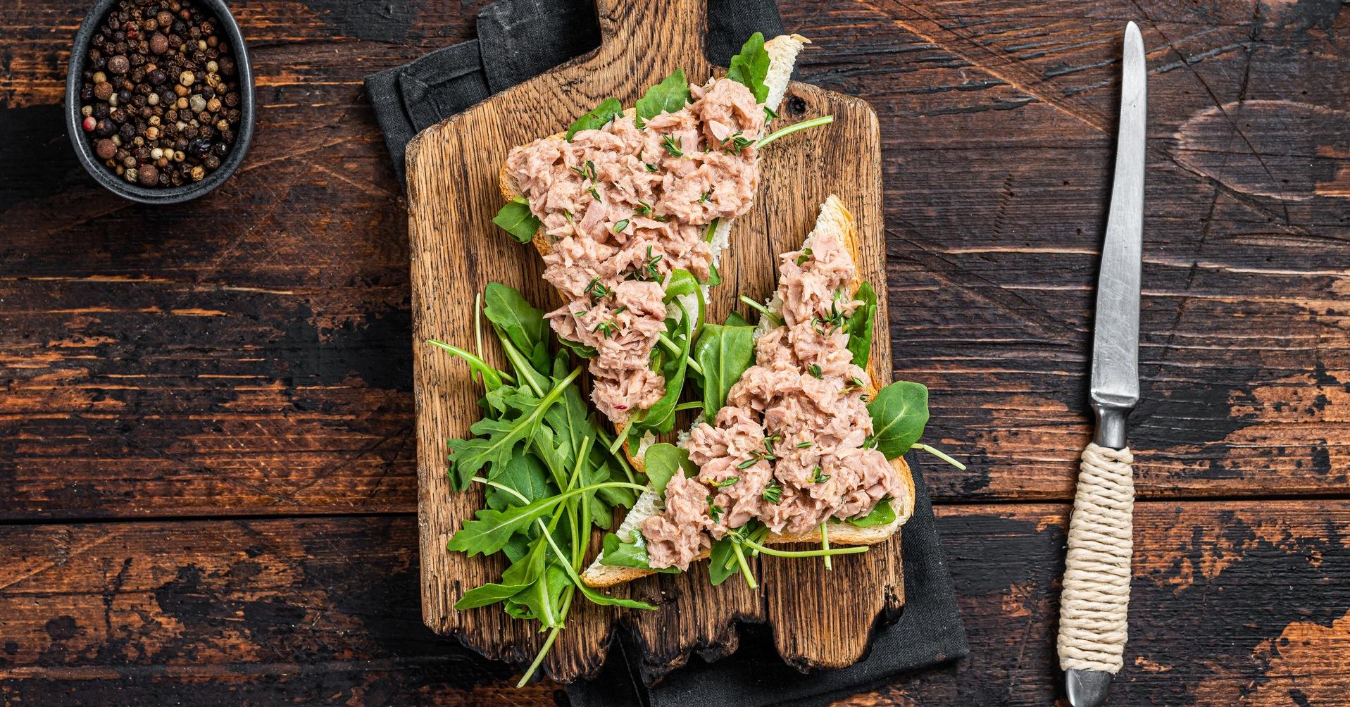 canned tuna toasts or sandwich with lettuce and arugula