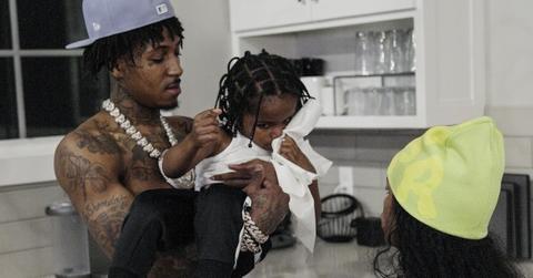 NBA YoungBoy poses with his child