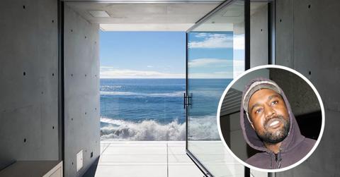 Kanye West and the glass door of his Malibu mansion overlooking the ocean.
