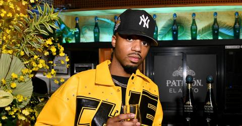GQ Hype celebrates Metro Boomin who is wearing a black and yellow jacket and a black hat in New York City at Public Records on December 08, 2022 in Brooklyn, New York.
