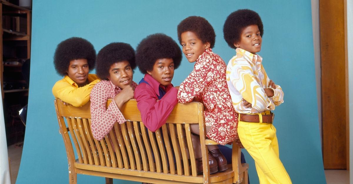 R&B quintet "Jackson Five" pose for a studio portrait sitting on a bench in circa 1972 in Los Angeles, California.