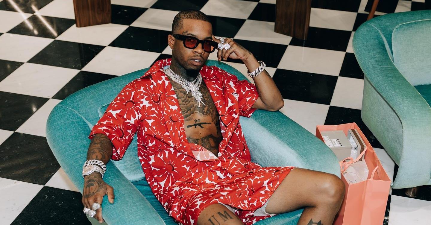 Tory Lanez wears a red bea