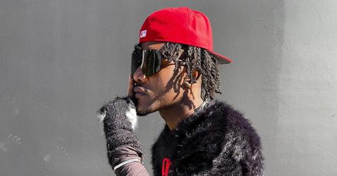 Side profile of Jadon Grundy wearing a red hat and fuzzy black pullover.