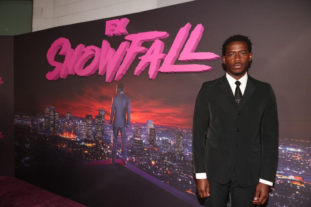 Damson Idris wears a suit at the premiere of 'Snowfall' Season 5 held at Grandmaster Recorders.