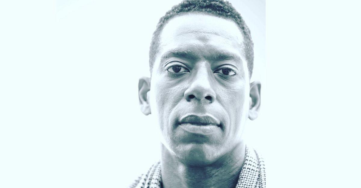 Orlando Jones posing for a headshot in black and white