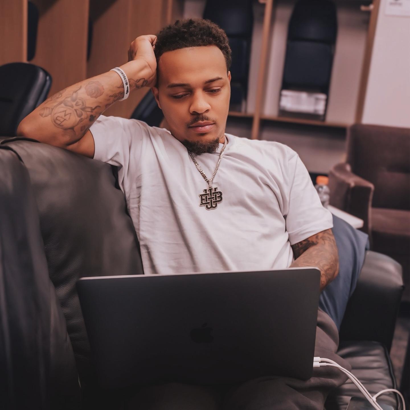 Bow Wow works on his laptop