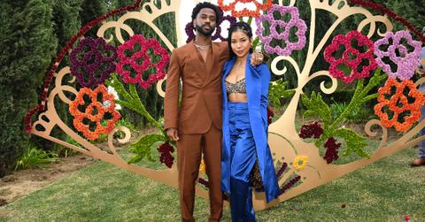 Jhene AIko and Big Sean hugging infront of flowers