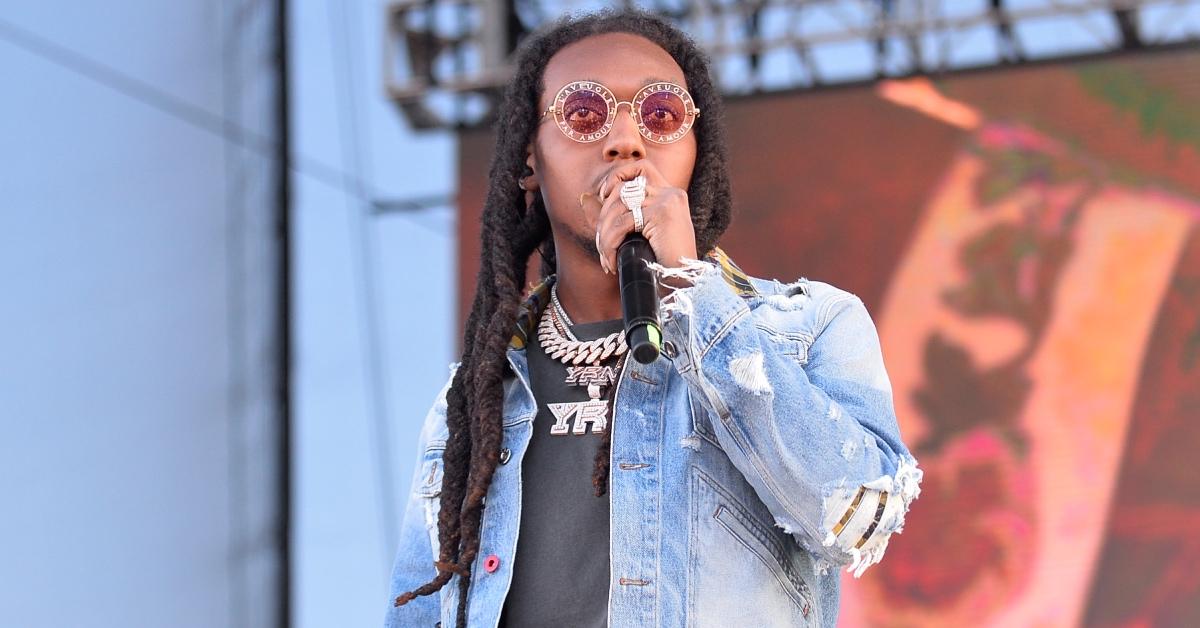 Takeoff of the Migos performs wearing a denim jacket.