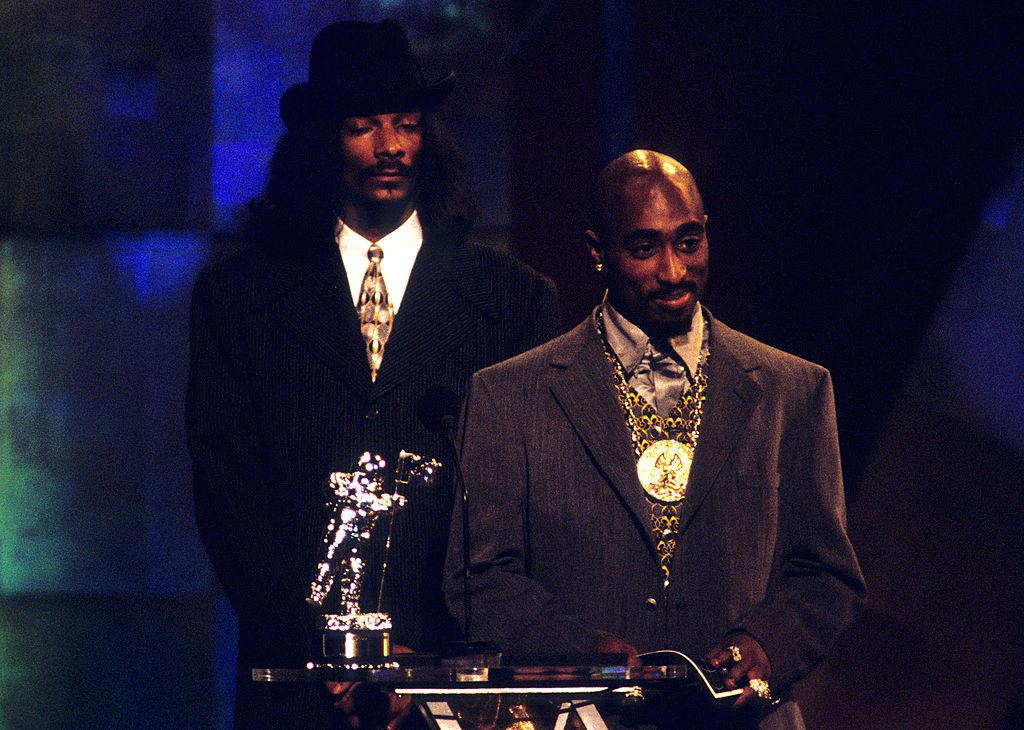 Snoop Dogg and Tupac Shakur wear suits at the MTV Awards. 