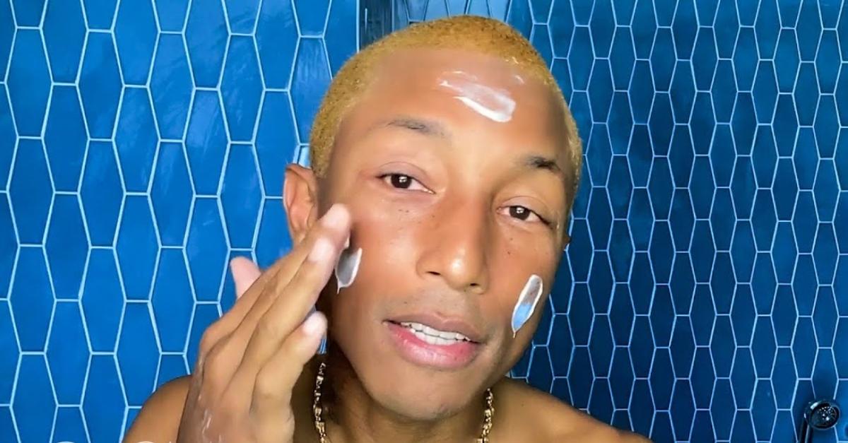 Pharrell applies skincare product in an episode of Vogue's 'Beauty Secrets'