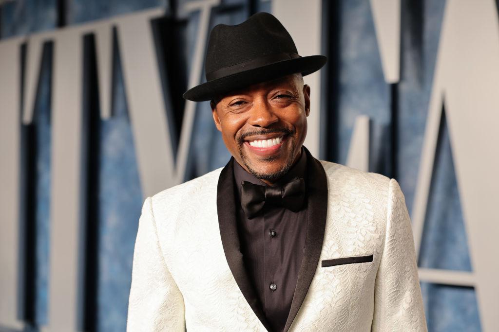 Will Packer wears a black and white tuxedo at Vanity Fair's Oscar party.