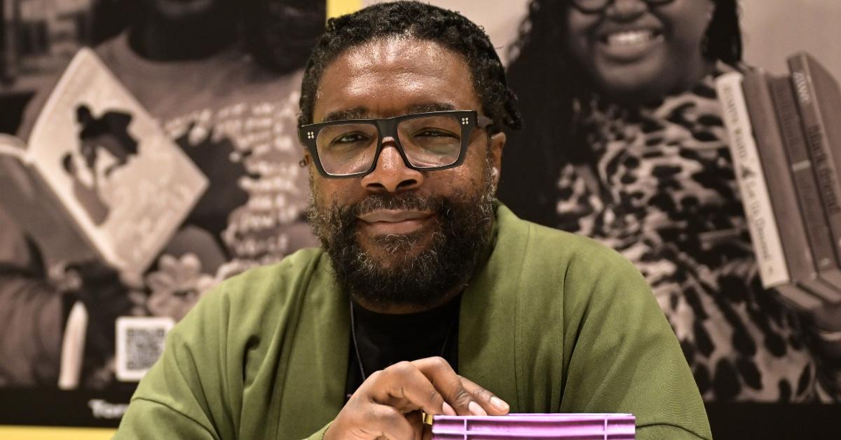 questlove signs books during  essence festival of culture