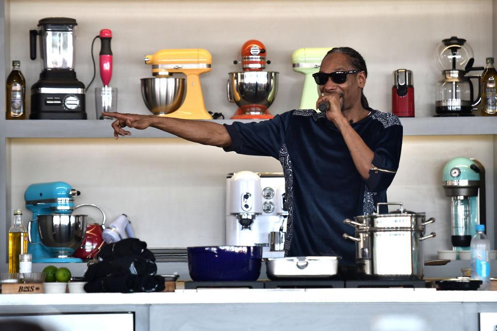 snoop dogg in the kitchen with a microphone