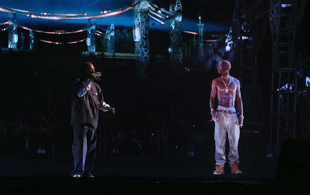 Rapper Snoop Dogg (L) and a hologram of deceased rapper Tupac Shakur perform onstage during day 3 of the 2012 Coachella Valley Music & Arts Festival