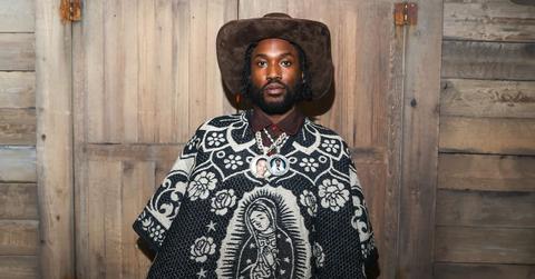 Meek Mill wears a cowboy hat and parka