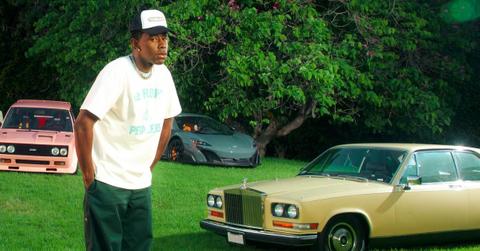 Tyler, the Creator in his yard with all his cars